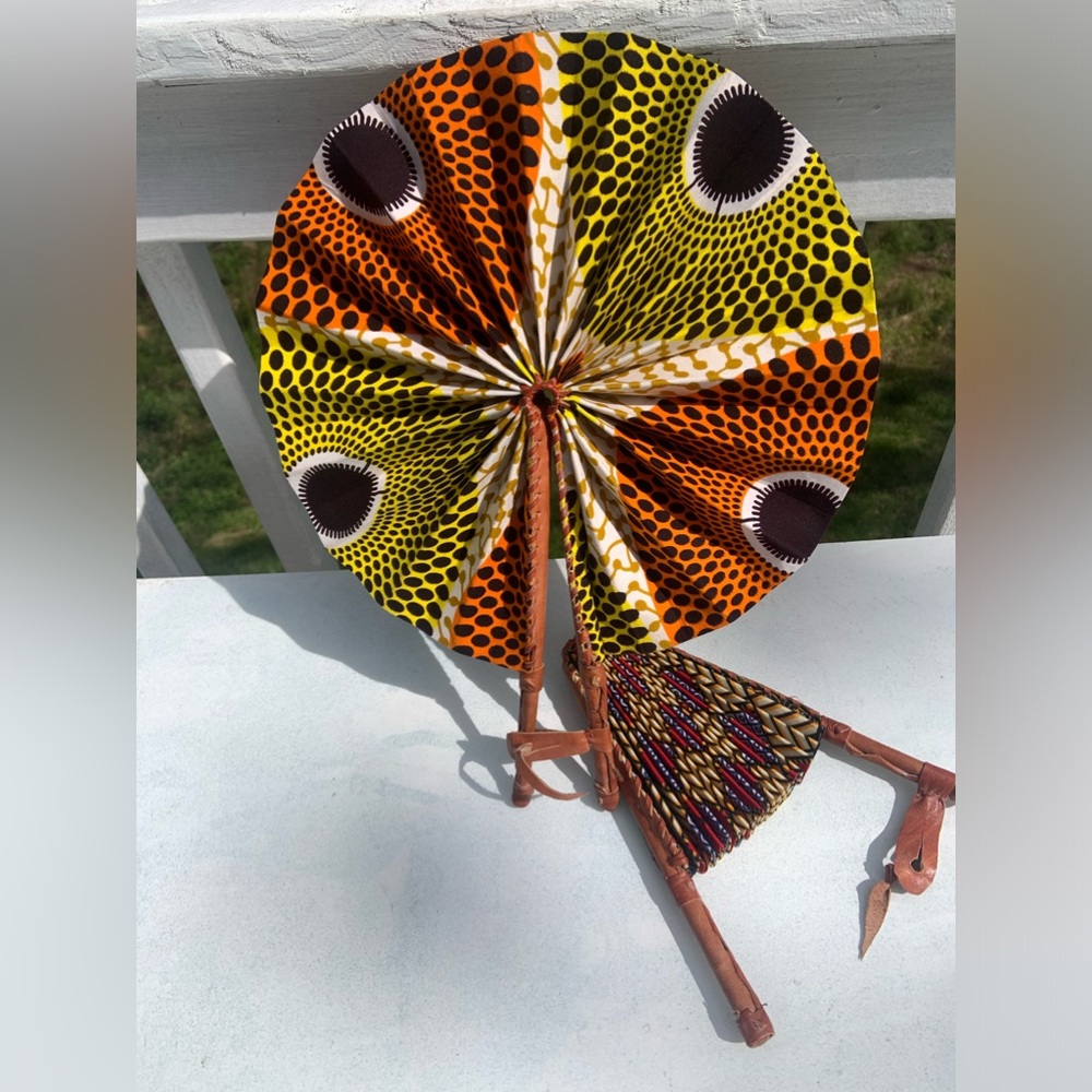 African fan made out of leather trimmings and African fabric.